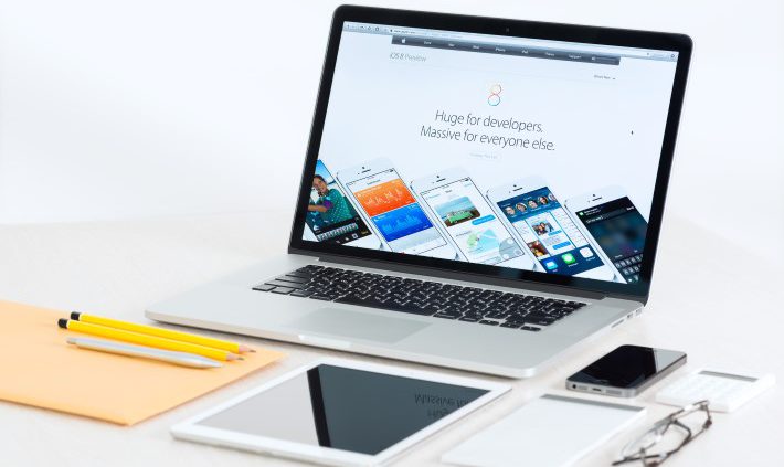 Apple Devices On A Desk Presenting Ios 8